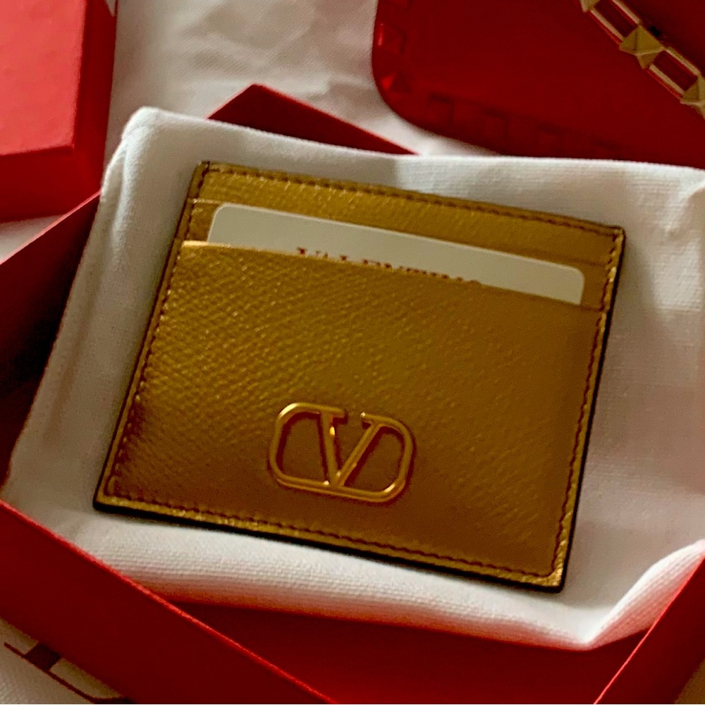 Authentic , brand new goldenValentino Gold Card Holder  with compartments. Must!